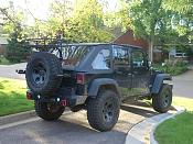 Rear tire carrier and soft top